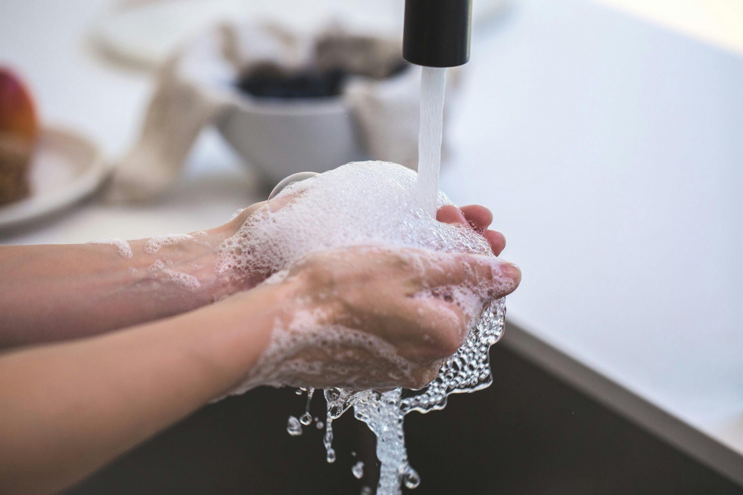 washing hands is an important part of preventing the spread of the flu virus.